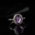 Macro view of an oval purple gemstone set in a textured S925 sterling silver ring - Open Size (LR324-1) / Natural Amethyst