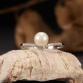 Detailed view of S925 sterling silver V-shaped ring featuring a lustrous natural pearl. - Natural Freshwater Pearl Ring Silver