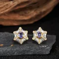 Detailed macro view of vintage silver star stud earrings with purple tanzanite stones - Natural Tanzanite (LN375) / Stud Earrings