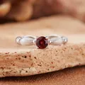Detail view of natural round red garnet gemstone ring with textured S925 silver band - Natural Garnet Ring