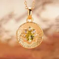 Macro view of a gold-plated S925 sterling silver pendant with a yellow-green gem - Natural Peridot (Gold)