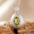 Macro detail of S925 silver oval green gemstone pendant with elegant brushed texture - Natural Peridot Necklace Silver