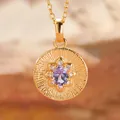Detailed view of a gold tanzanite pendant featuring an intricate sunburst pattern. - Natural Tanzanite (Gold)