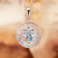 Close-up macro of S925 silver pendant necklace with sunburst pattern and blue gemstone - Natural Topaz (Silver)