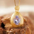 Close-up of elegant brushed S925 silver pendant with a lavender amethyst gemstone. - Natural Tanzanite Necklace Gold