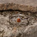 Detailed shot of a sterling silver sunburst ring featuring a warm amber gemstone - Open Adjustable / Natural Tiger Eye