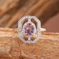 Detailed view of an ornate silver ring featuring a purple amethyst and halo setting. - Adjustable Ring (R521) / Natural Amethyst Ring