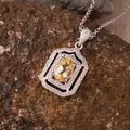 Detailed view of a yellow citrine pendant with silver frame on a natural stone surface. - Natural Citrine (N471)