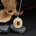 Vintage S925 silver necklace featuring an oval natural garnet pendant in a gold-tone medallion - Garnet (LN265)