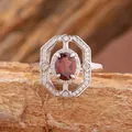 Detailed macro view of a vintage S925 silver ring with a central oval garnet gem - Adjustable Ring (R521) / Natural Garnet Ring