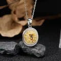 Exquisite close-up of a vintage S925 silver round pendant with a yellow oval gemstone - Citrine (LN265)