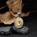 Vintage S925 sterling silver oval pendant with light blue gemstone resting on rocks - Topaz (LN265)