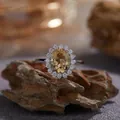 Detailed macro view of an elegant silver ring with a yellow oval gemstone halo - Natural Citrine Ring