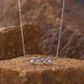 Exquisite close-up of S925 silver necklace with pearls resting on a natural stone - Pearl Necklace / Silver