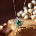 Elegant S925 silver daisy necklace featuring an oval green emerald gemstone pendant - Necklace / Emerald