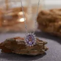 Close-up of elegant oval amethyst pendant necklace on natural stone - Natural Amethyst Necklace