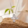 Detailed close-up of S925 sterling silver four-leaf flower necklace with pearl and stones - Natural Freshwater Pearl Necklace / Silver