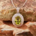 Macro view of natural green citrine pendant necklace featuring double halo of micro stones - Natural Peridot Necklace