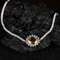 Gros plan d'un bracelet de tennis en argent avec une pierre de citrine jaune ovale - Bracelet Citrine Naturel