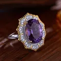 Detailed macro view of a Victorian-style oval amethyst ring with silver halo setting. - Natural Millennium Cut Amethyst