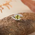S925 sterling silver ring featuring an oval yellowish-green gemstone and zircon accents - Peridot