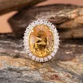 Close-up of natural oval citrine pendant with sparkling double halo in S925 silver - Natural Millennium Cut Citrine Ring / Yellow