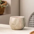 Close-up of ceramic succulent pot with green marble texture and geometric shape - Geometric Rhombus / Green Marble Pattern