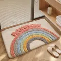 Soft absorbent tufted bath mat with colorful rainbow pattern and decorative text - 40*60cm / Over The Rainbow