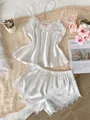Elegant pearl white satin pajama set featuring lace trim camisole and matching shorts - S / Top And Bottom / White