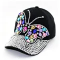 Detailed view of a black baseball cap featuring a vibrant rhinestone butterfly design. - Adult, Hat Circumference 58cm Adjustable / Black