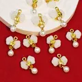 Close-up of bow-knot pearl pendants with faux jade stone for DIY jewelry making. - White (B545#)