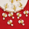 Close-up of bow-knot pearl pendants with faux jade stone for DIY jewelry making. - White (B545#)