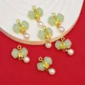 Detailed view of bow knot pendants with faux jade and pearls for DIY jewelry crafts - Light Green (B546#)