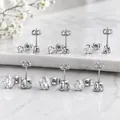 Detailed view of six pairs of S925 sterling silver stud earrings with round clear zirconia - 7mm / Six-Prong Style (1 Pair, Card Packaging) / Silver