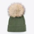 Detail view of a green ribbed knit beanie with a large fluffy faux fur pom-pom - Army Green