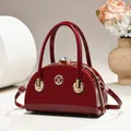 Elegant burgundy patent leather evening bag with large crystal clasp and gold handles - Glossy Style / Red