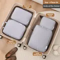Grey 4-piece travel packing cubes set for suitcase organization and storage - Four-Piece Set / Light Gray