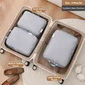 Premium grey 3-piece travel packing cubes set organized inside a beige suitcase - Three-Piece Set / Light Gray