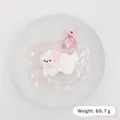 Adorable puppy squishy toy made of slow rebound silicone with pink bowknot and bell. - Dog / Pink