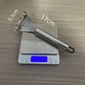Stainless steel corn stripper tool on scale showing 17cm length and weight measurement info - Black Hanging Loop Style / Bulk/Loose Packaging
