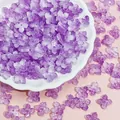 Detailed view of 10mm purple frosted glass four-petal flower beads for DIY jewelry - Gradient Purple (L941)