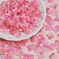 Close-up of pink 10mm shimmering glass four-petal flower beads for DIY jewelry - Gradient Pink (L943)