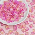 Detailed view of 10mm shimmering pink four-petal flower beads for DIY crafts - Yellow Purple (L946)