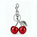 Metalen rode kers sleutelhanger met zilveren blad hanger en stevige karabijnsluiting - 32mm / Zilveren Staaf / Verguld Rood