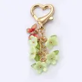 Elegant flower keychain with red butterfly and light green blossom charms for bags - Flower String / Plated Yellow