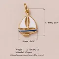 Gold sailboat charm pendant with white enamel sails and blue hull detail - Sailboat Pendant (5)