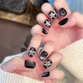 Elegant black cat-eye press-on nails featuring decorative silver star charms. - M / 10 Pieces Bag (with Tool Kit) / Dark Night Starry Sky Style (BY1870)