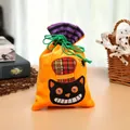 Detail view of a Halloween drawstring candy bag with an embroidered black cat face - Orange/Black Cat Style
