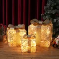Set aus drei leuchtenden Weihnachtsgeschenkboxen mit goldenen Schleifen und Licht - Champagner Gold Pailletten Stil (BY2305)