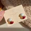 Elegant Ankola red and white dripping oil stud earrings presented on a display card - Red and White Ball Style
